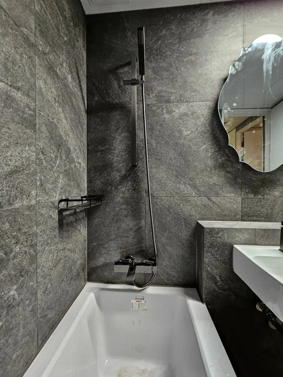 Dark slate wet room & bath — Hackney, London