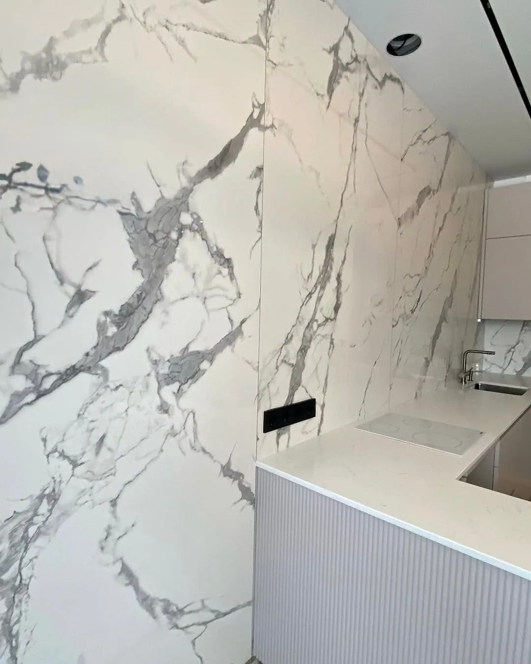 Calacatta slab kitchen with fluted island — Southwark, London